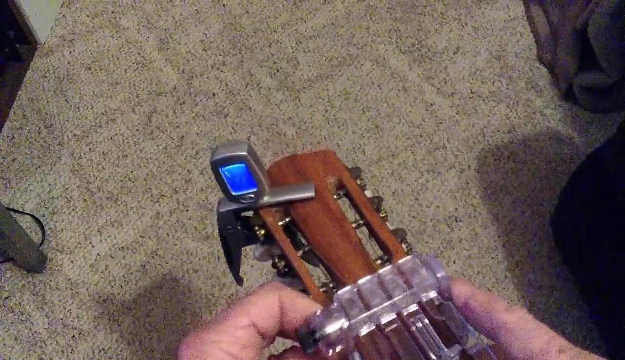 Screenshot showing the Chord Buddy attached to the wide-neck guitar
