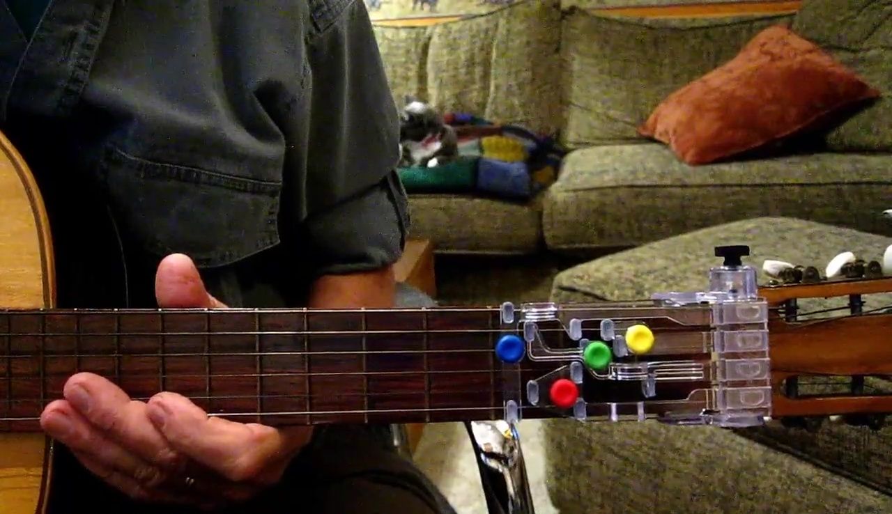 Screenshot mentioning the speaker's wide-neck guitar from Vietnam