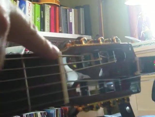 Tuning the low E string.