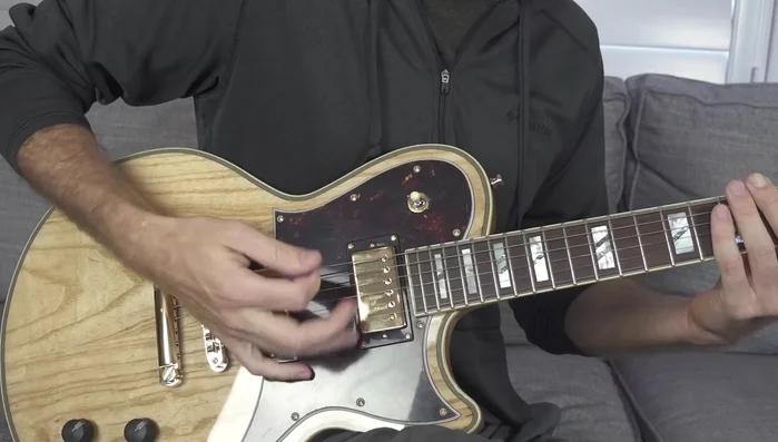 Practice single-string picking, initially focusing on downstrokes, then incorporating alternate picking.