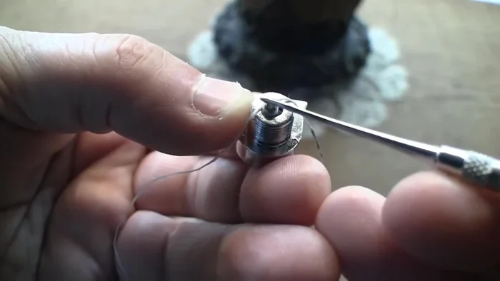 Create a small loop with dental floss.