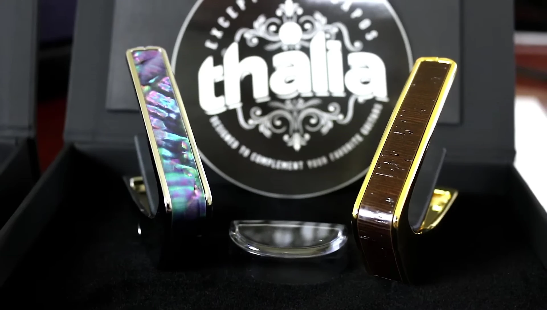 The gold finish with African wing inlay