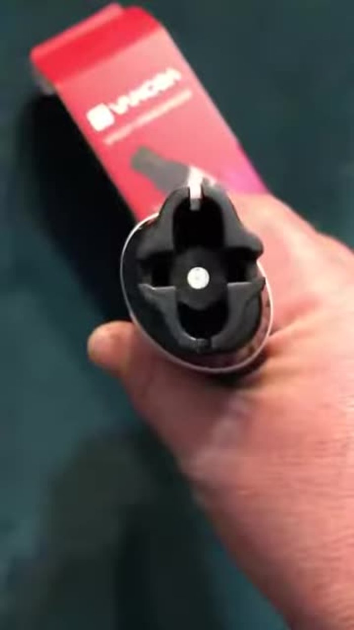 Assess the string winder's size and fit it onto the tuning peg.