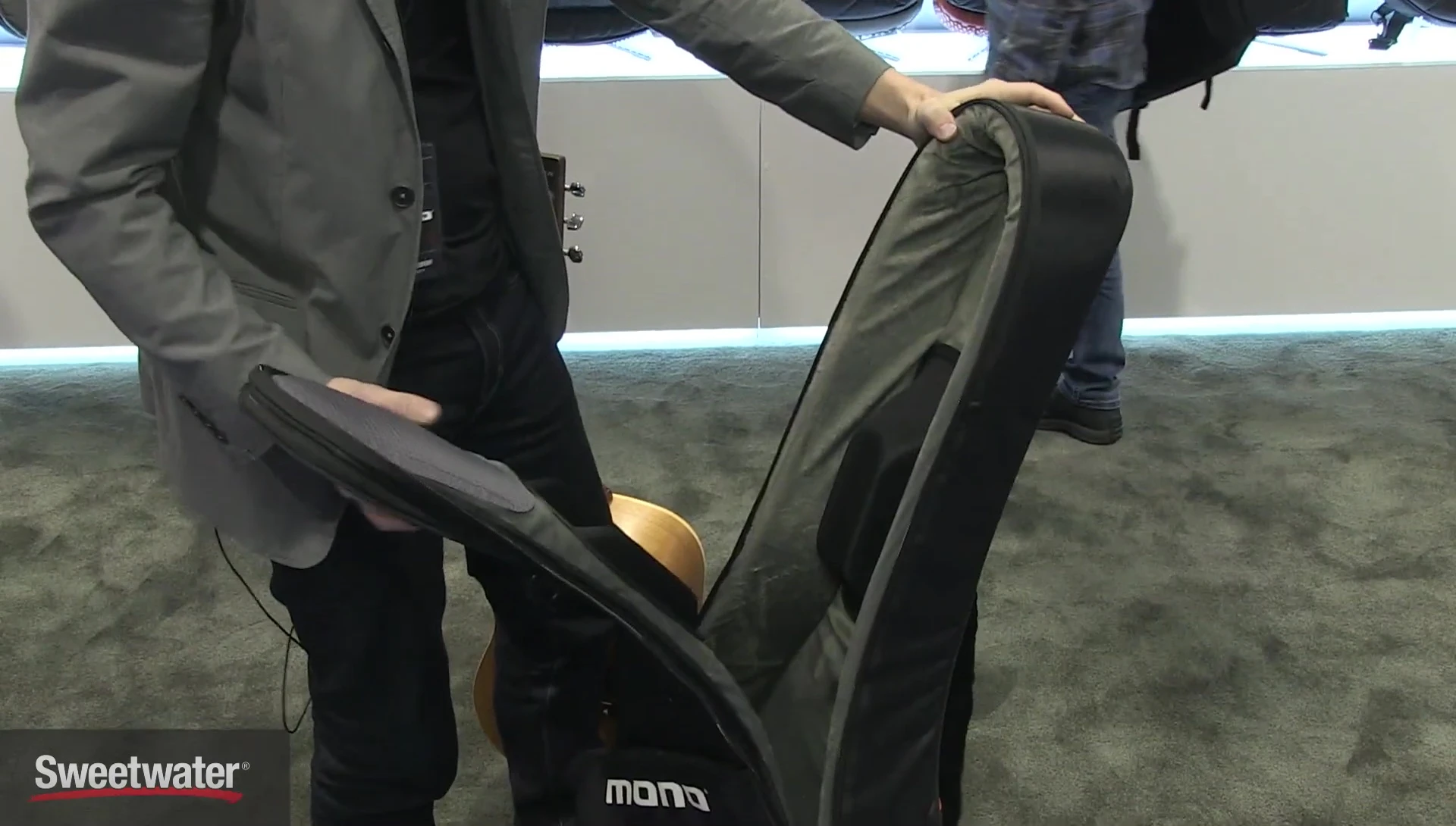 The headlock system clamping down on the guitar neck.
