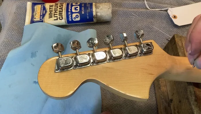 Reinstall the tuner and tighten the screws gently.