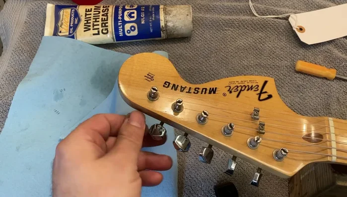 Reinstall the string and tune the guitar.