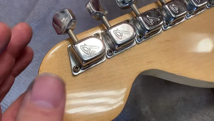 Remove the internal tuner plate by gently applying leverage to the tuning key.