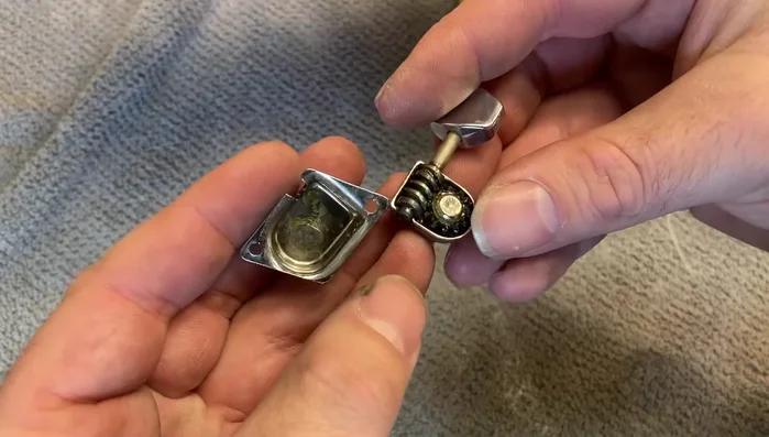 Remove the internal tuner plate by gently applying leverage to the tuning key.