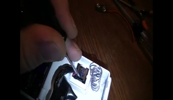 Cut the zip tie securing the battery plug.