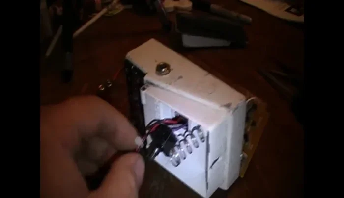 Cut the zip tie securing the battery plug.