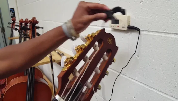 Turn on the tuner and ensure the frequency is set to 440 Hz.