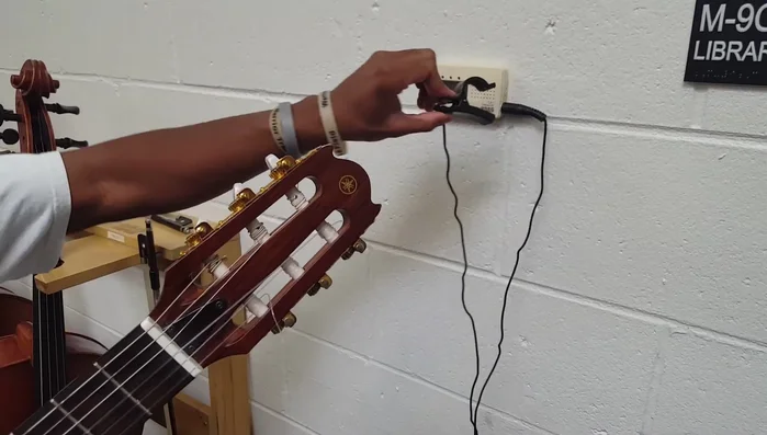 Remove the tuning clip from your guitar, place it back on the tuner, and turn off the tuner.