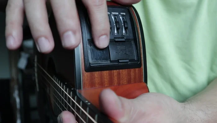 Activate the tuner on your guitar's preamp.