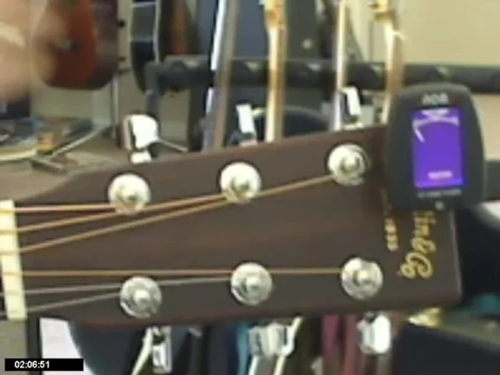 To ensure the tuner gets a clear reading, pluck the string every few seconds while tuning.