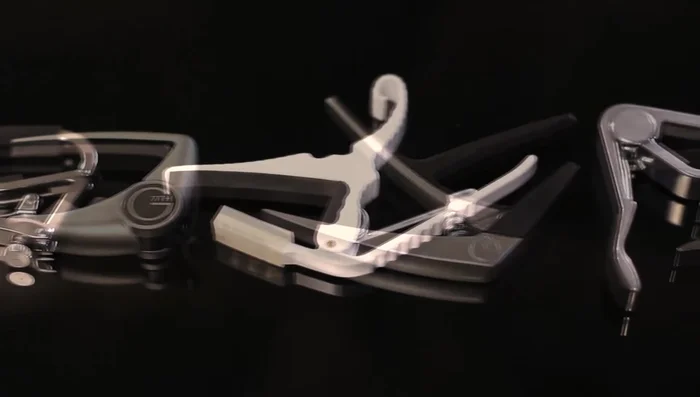 The Problem with Traditional Capos: Traditional capos often use a 13-inch radius, leading to uneven pressure on strings depending on the guitar's actual radius. This results in inconsistent tuning and tone (too much pressure on inner or outer strings).