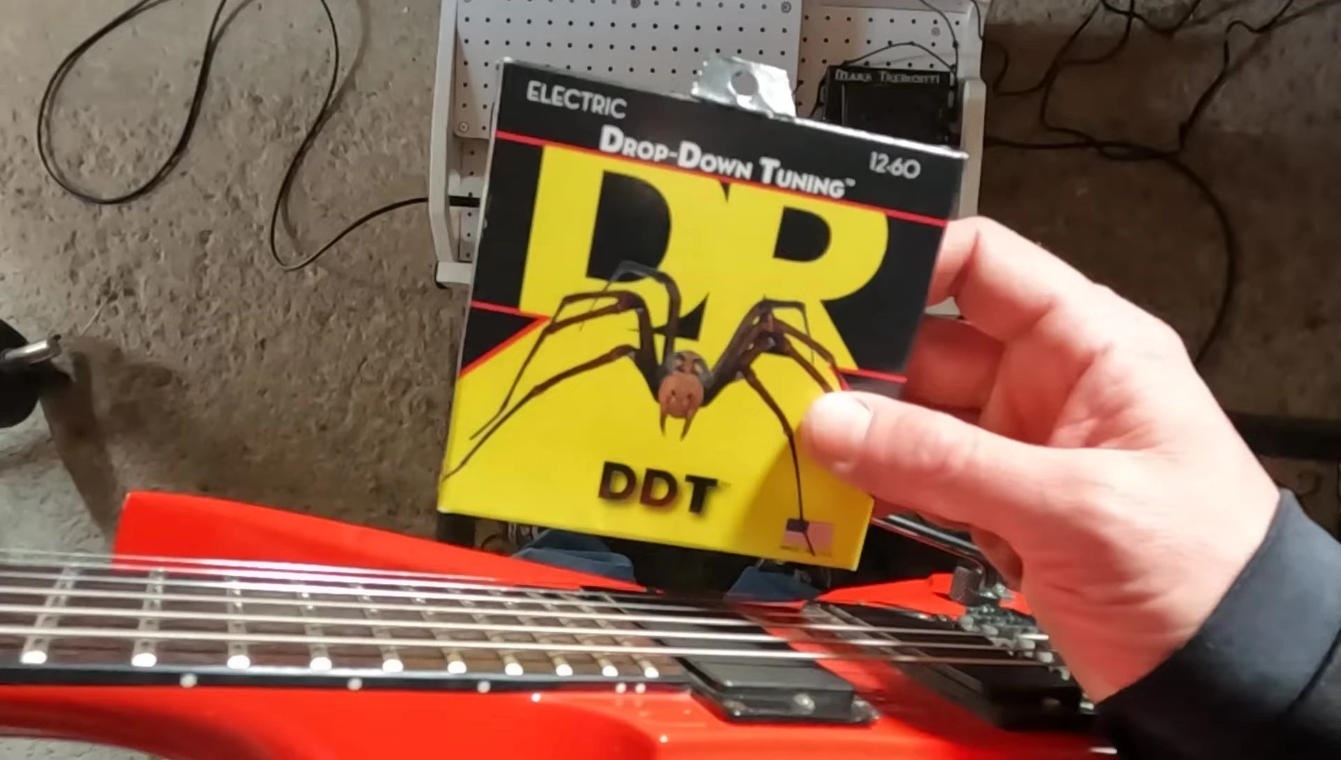 The guitarist explains the process of dropping to A tuning.