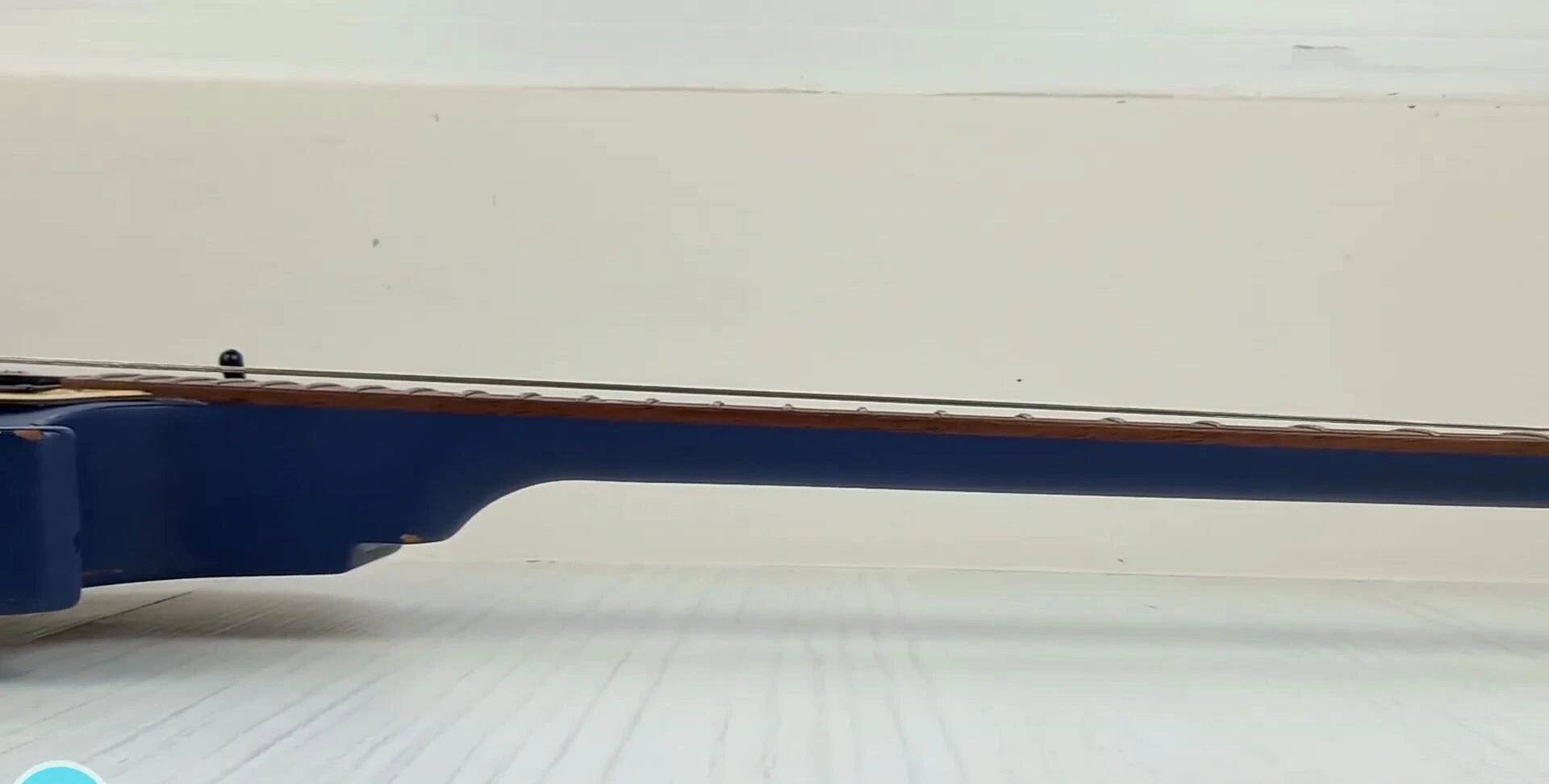 Diagram or video showing truss rod adjustment.