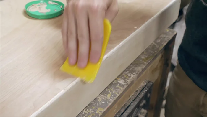 Fill screw holes and gaps with wood filler and sand smooth.