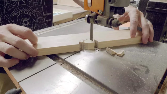 Cut a slot for the neck using a bandsaw and trim for a snug fit. Account for added interior padding.