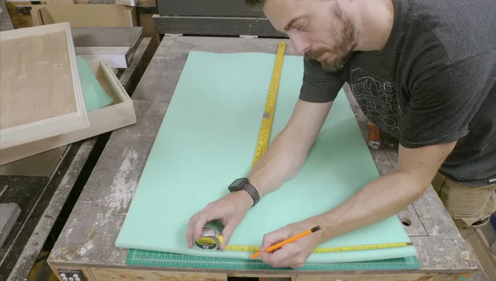 Line the inside of the case with 1-inch upholstery foam, cutting to wrap around the guitar.