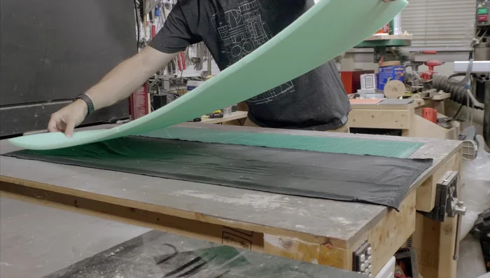 Apply velvet to the foam lining using spray adhesive. Work carefully to avoid wrinkles.