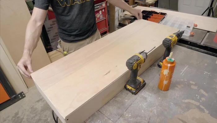 Create the top and bottom using 1/8 inch plywood, gluing and screwing them to the box.