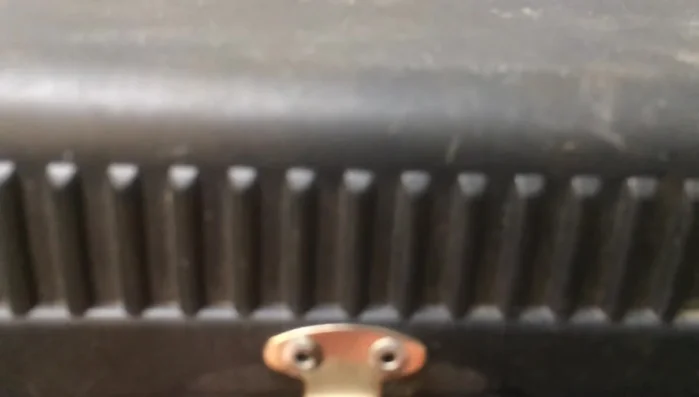 Stack three washers on each rivet before securing the latch.