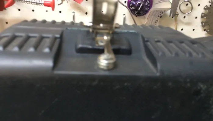 Stack three washers on each rivet before securing the latch.