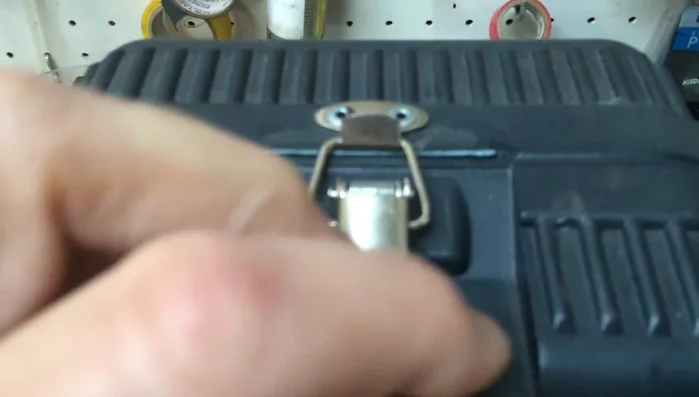 Use a small piece of solder (or similar) to lock the latch in place.