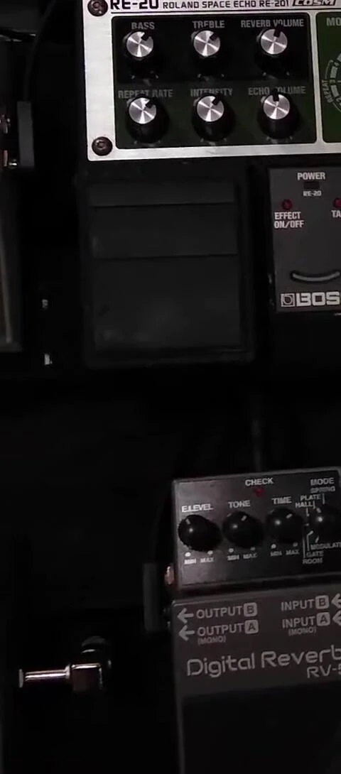 Close-up of the speaker discussing his love for effects pedals.