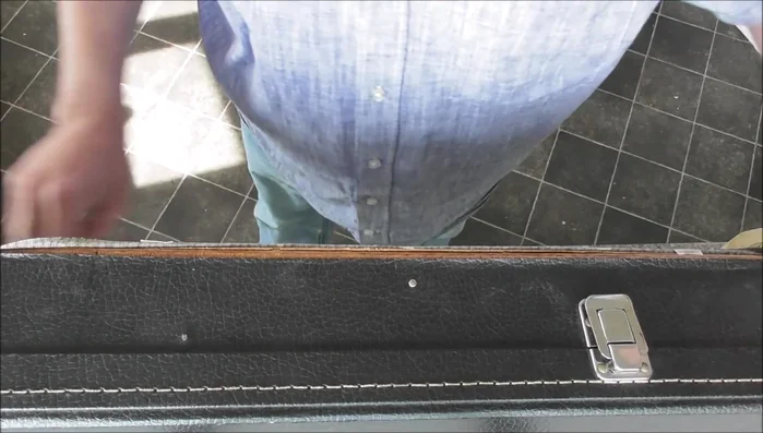 Carefully adhere the vinyl back to the item, working in sections. Use a tool like a spatula to smooth out the glue and remove air bubbles.