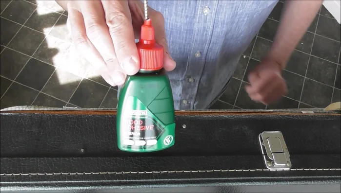 Carefully adhere the vinyl back to the item, working in sections. Use a tool like a spatula to smooth out the glue and remove air bubbles.