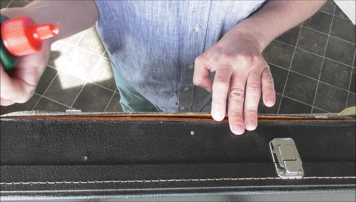 Carefully adhere the vinyl back to the item, working in sections. Use a tool like a spatula to smooth out the glue and remove air bubbles.