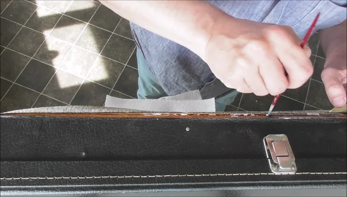 Secure the repair with tape, ensuring even pressure along the seams and edges.