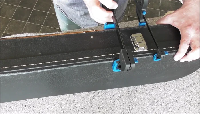 Once the glue is dry, any remaining loose pieces can be carefully adhered using glue and tape.