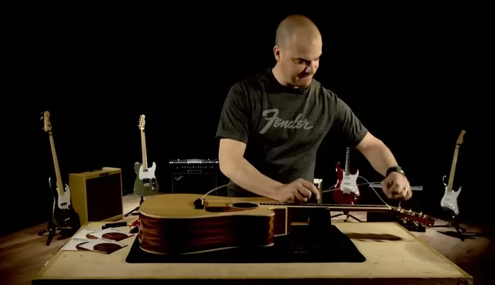 Remove the bridge pins using the string winder or your fingers (if not stuck).