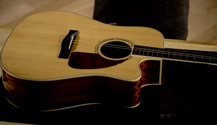 Remove the bridge pins using the string winder or your fingers (if not stuck).