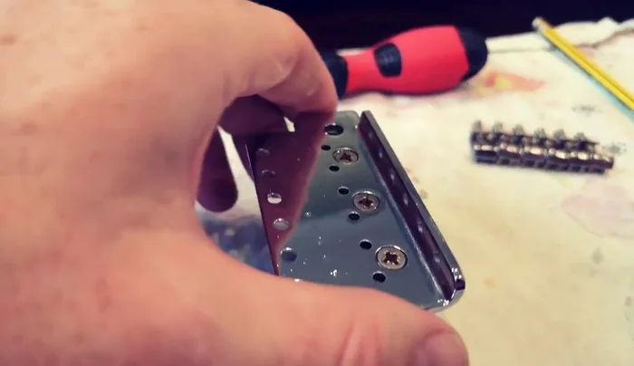 Install new strings and tune the guitar.