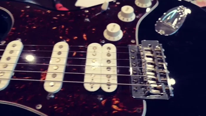 Install new strings and tune the guitar.