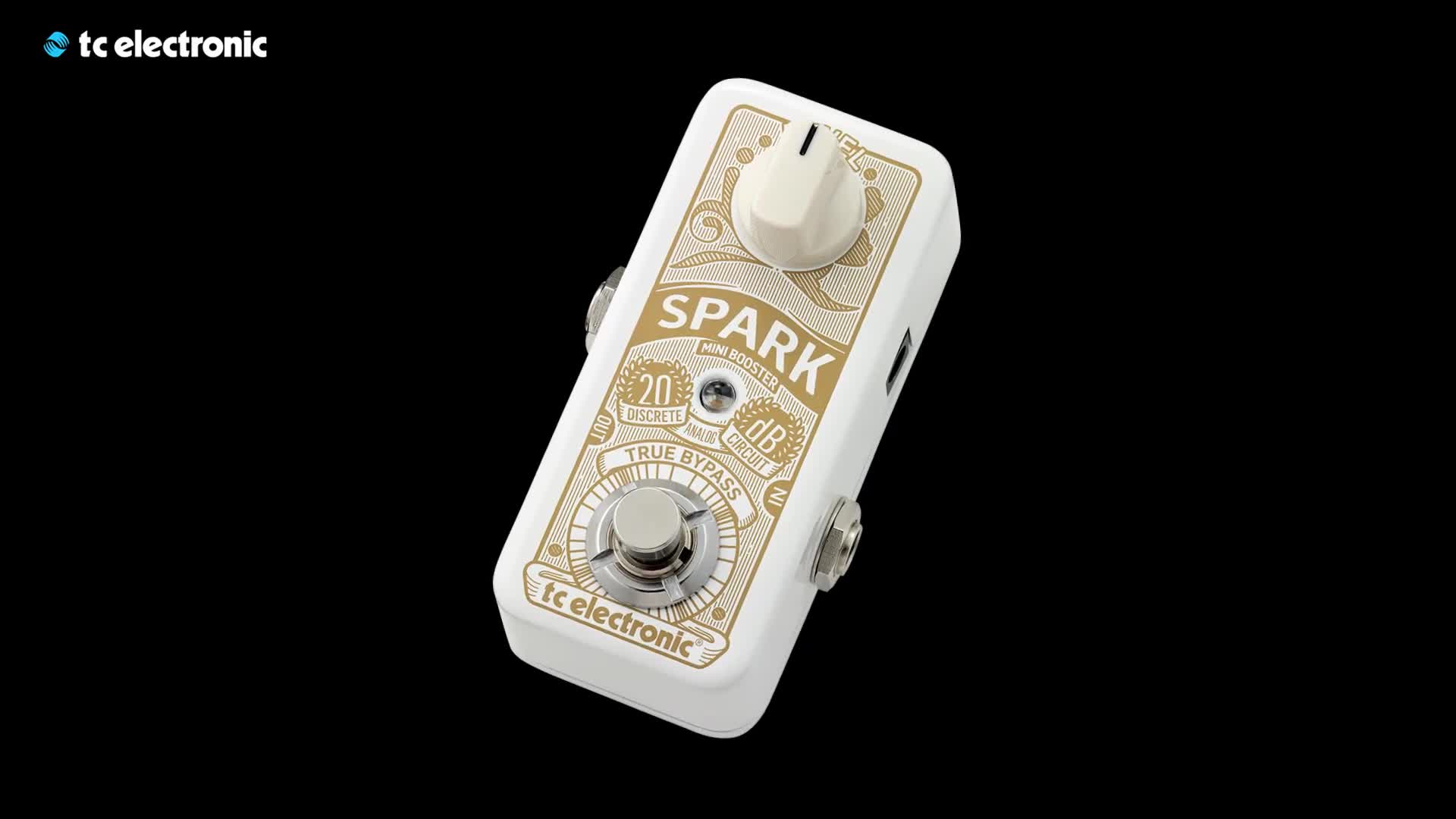 The speaker with the pedalboard showcasing the size of the Spark Mini Booster.