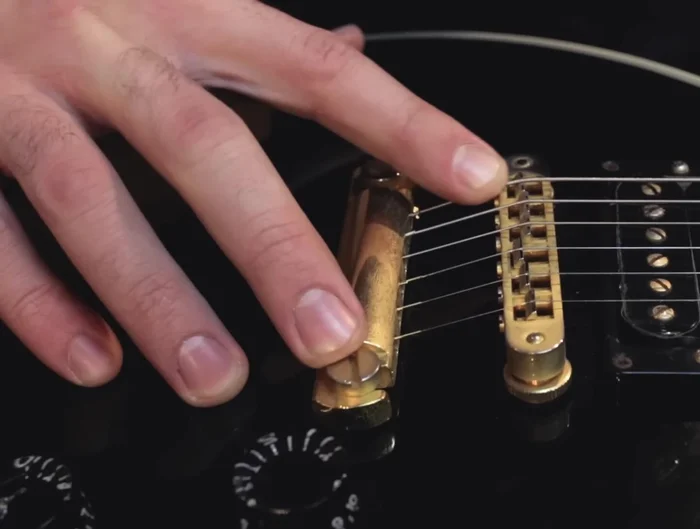 Ensure the string is seated well on the saddle and nut slot. Cut the extra string with wire clippers.