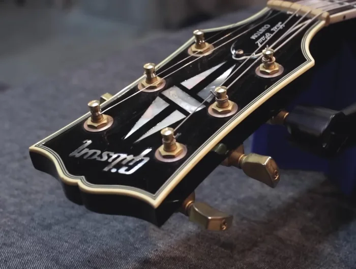 Remove old strings one at a time. Loosen the tension, cut the string with wire clippers, unwind it from the tuner, and remove the string from the tailpiece.