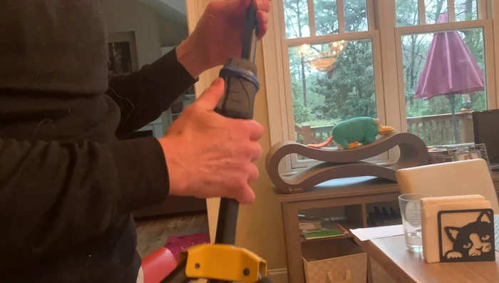 Wrap electrical tape around the wire to reinforce the knot and secure the wire in place.