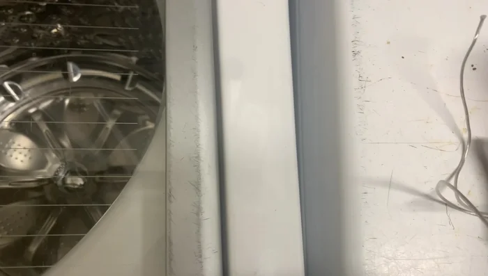 Clean the sticky residue from the plastic handle with rubbing alcohol.