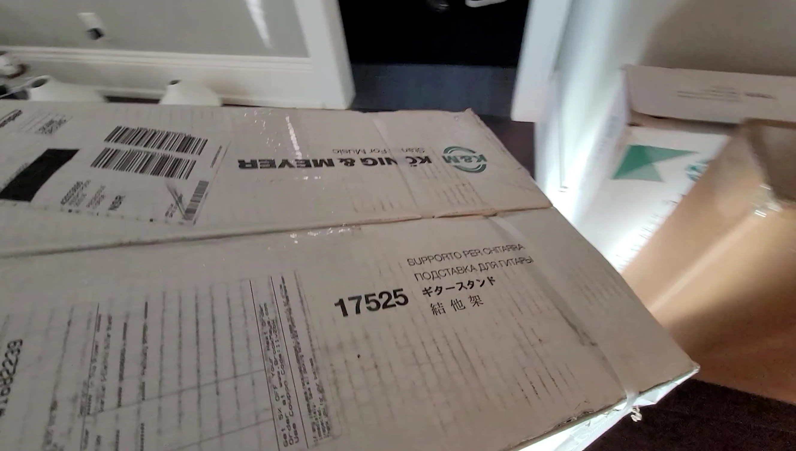 The K&M Guardian 5 multi-guitar stands in their packaging.