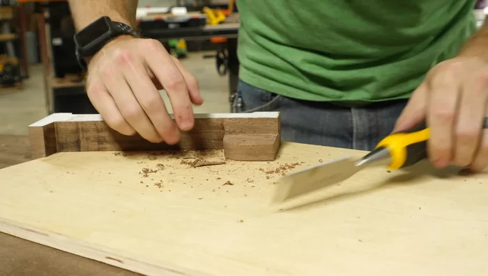 Use a chisel to smooth the rabbet surfaces.