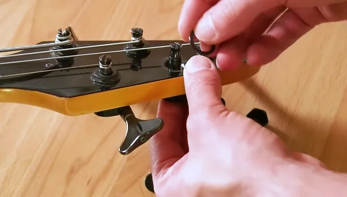 Add the screw to the back and snug the top with the wrench.