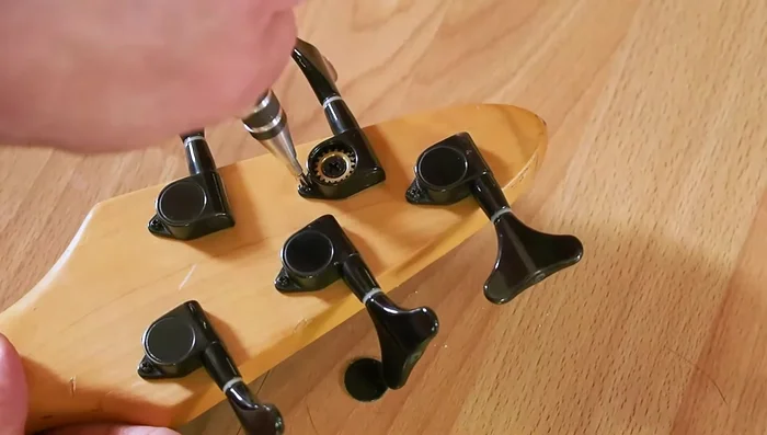 Add the screw to the back and snug the top with the wrench.