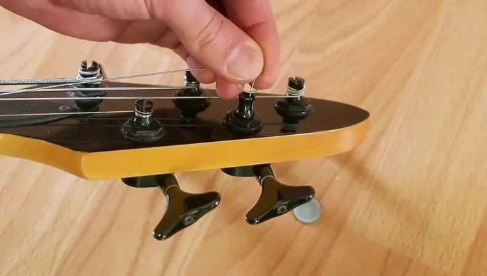 Optionally, reattach the cap using quick-drying glue and gloves to avoid getting glue on the guitar. (Alternatively, use regular glue and tape to hold the cap in place while it dries).