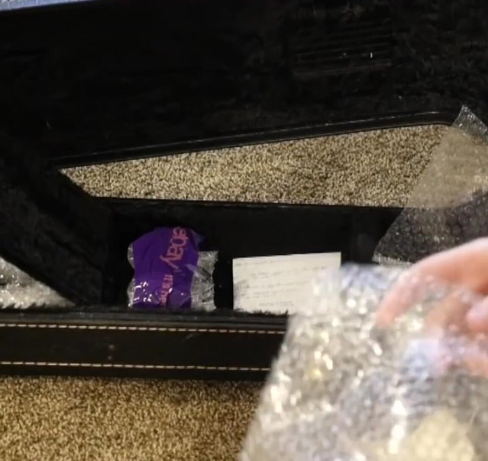 Add more bubble wrap to fill empty spaces within the case, securing the small parts.